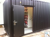 Mobile shelving in storage container